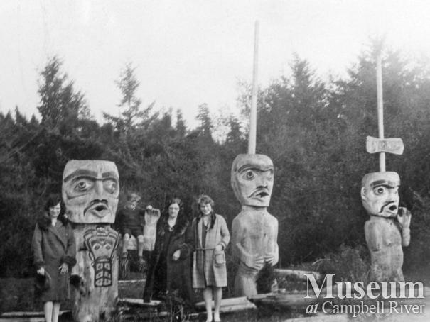 Three totems at Cape Mudge beach near the old burial ground