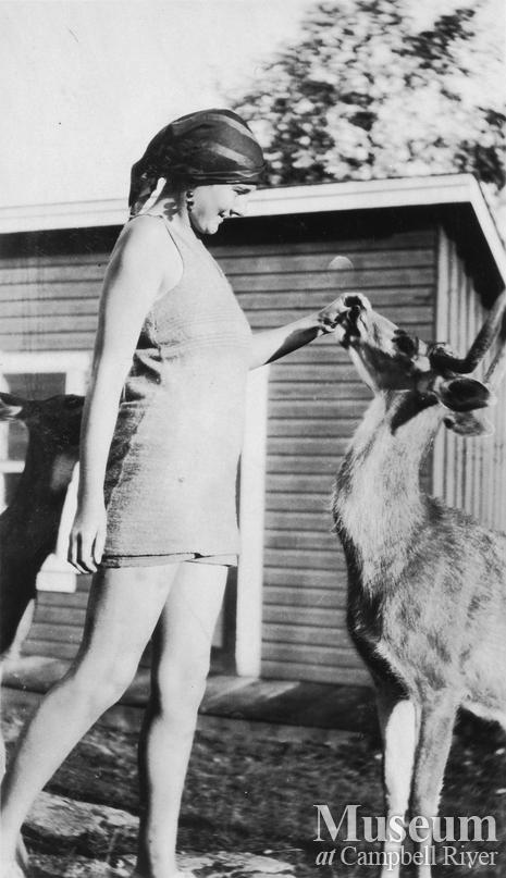 Woman with one of Tom Brazil's pet deer