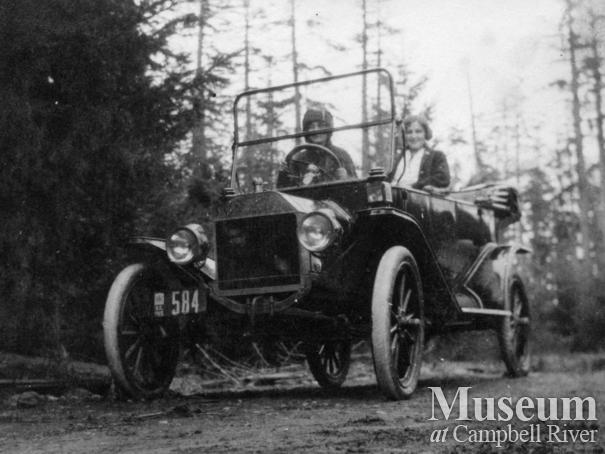 Two young ladies in a car at Sunny Side Farm, Quadra Island
