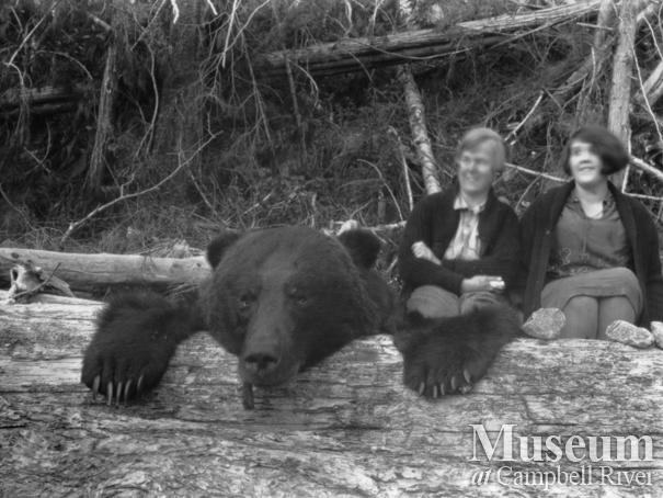 Mrs. Johnson and Zaida Schnarr with bear pelt 