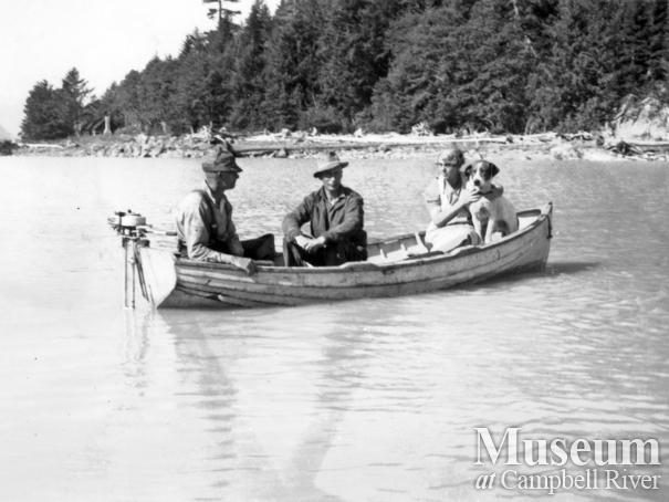 Group in wooden boat at the head of Knight Inlet