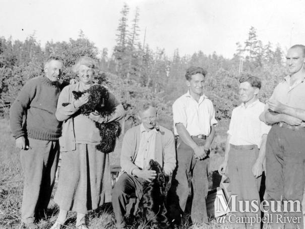 Francis and Amy Barrow with a group of residents